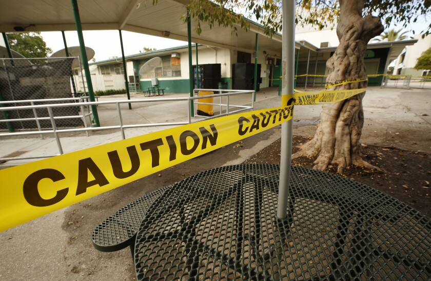 Common areas at Dorsey High School are cordoned off with caution tape in March.