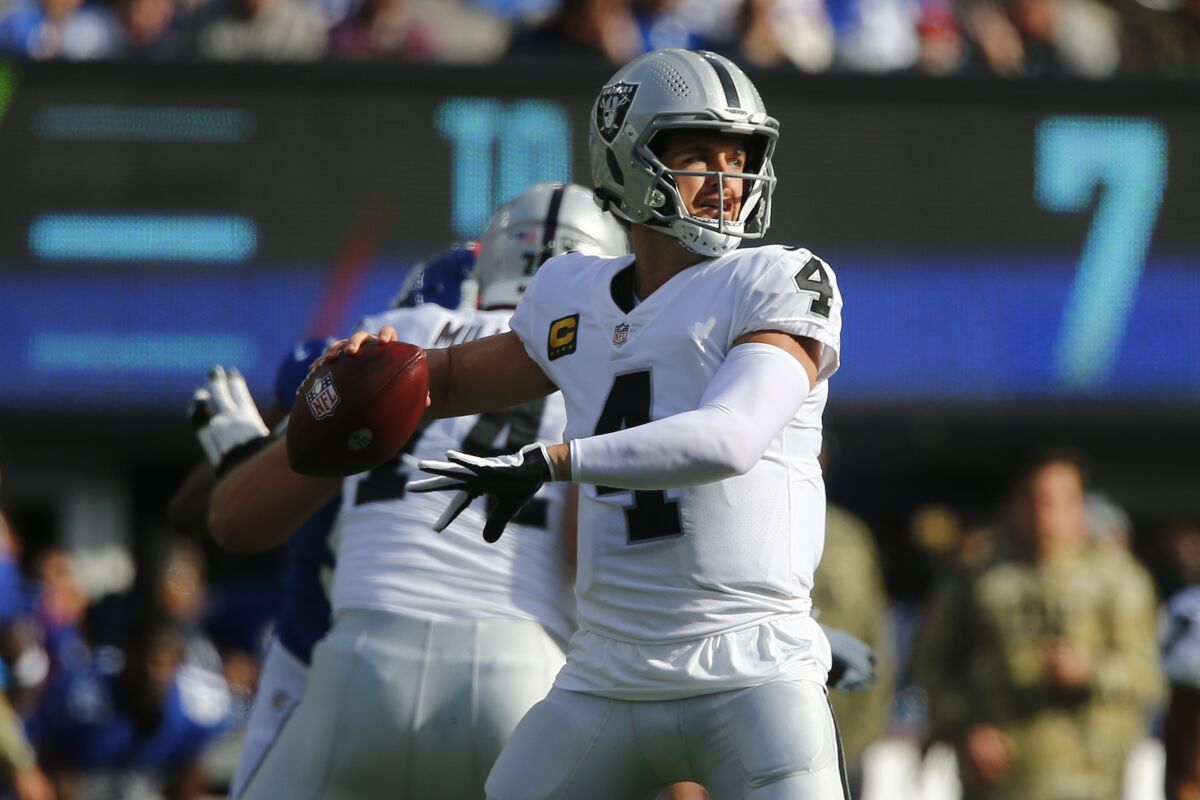 Las Vegas Raiders quarterback Derek Carr (4) throws a pass during the first half of an NFL football game against the New York Giants, Sunday, Nov. 7, 2021, in East Rutherford, N.J. (AP Photo/John Munson)