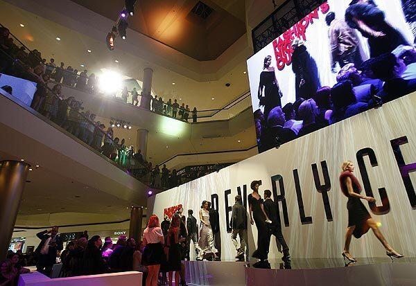 Models strut across the runway during a fashion show at the Beverly Center during the annual Fashion's Night Out.