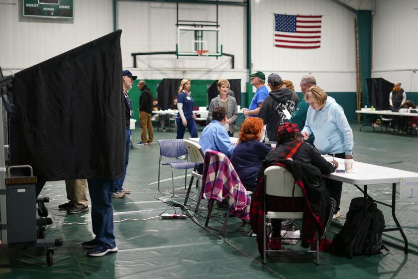 FILE - Voters check in at their polling place before casting their ballots on election day in Philadelphia, Nov. 7, 2023. President Joe Biden and former President Donald Trump will go before voters April 23, 2024, in Pennsylvania's presidential primaries, a prelude to the November general election when the commonwealth is expected to once again to play a critical role in the race for the White House.(AP Photo/Matt Rourke)