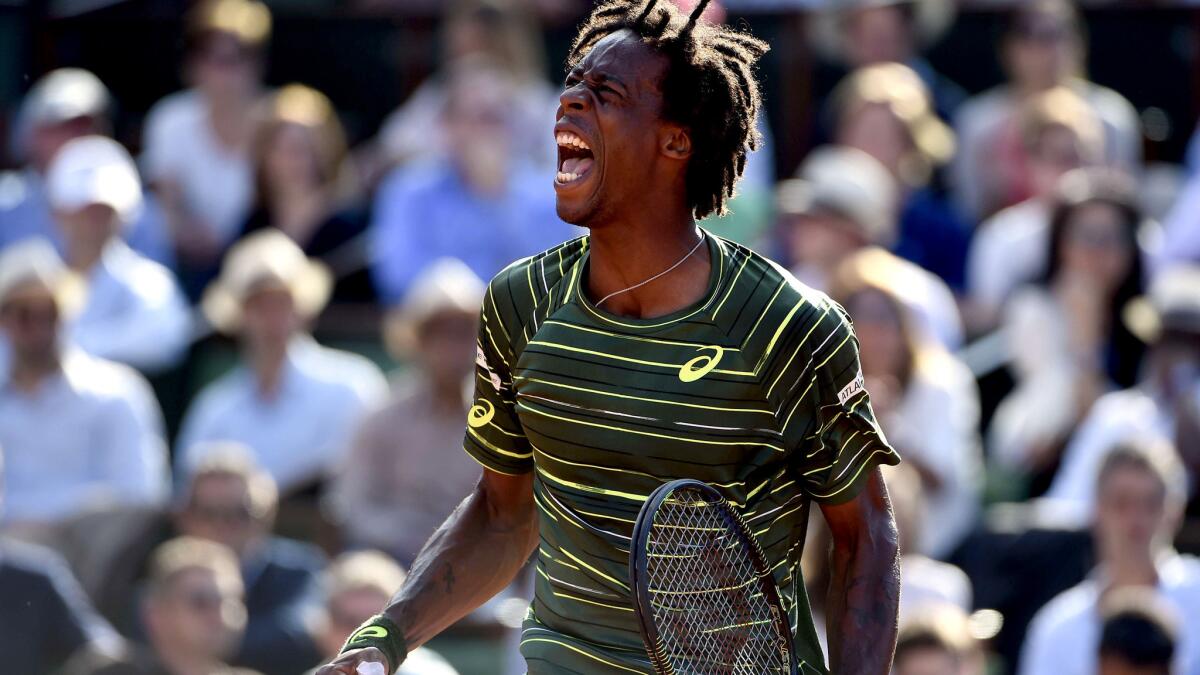 Gael Monfils reacts after winning a point against Diego Schwartzman during their second-round match at the French Open on Wednesday in Paris.