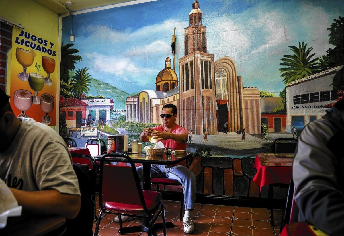 The Birrieria Apatzingan restaurant in Pacoima is named after the city in Michoacan, Mexico, where many of its workers and customers are from. The Knights Templar drug cartel has made that city its stronghold, but civilians are fighting back.