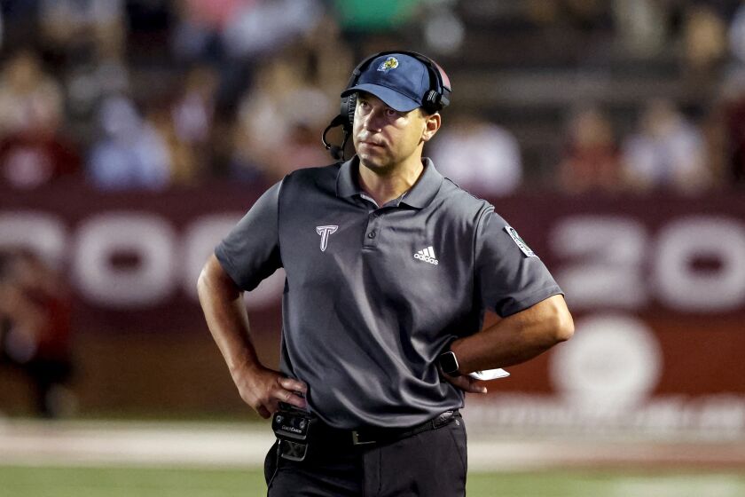 FILE - Troy head coach Jon Sumrall reacts after a play during the first half of an NCAA college football game against Marshall, Sept. 24, 2022, in Troy, Ala. Sumrall has agreed to a new four-year contract as Troy’s coach after leading the Trojans to a Sun Belt Conference championship and national ranking in his debut season. (AP Photo/Butch Dill, File)