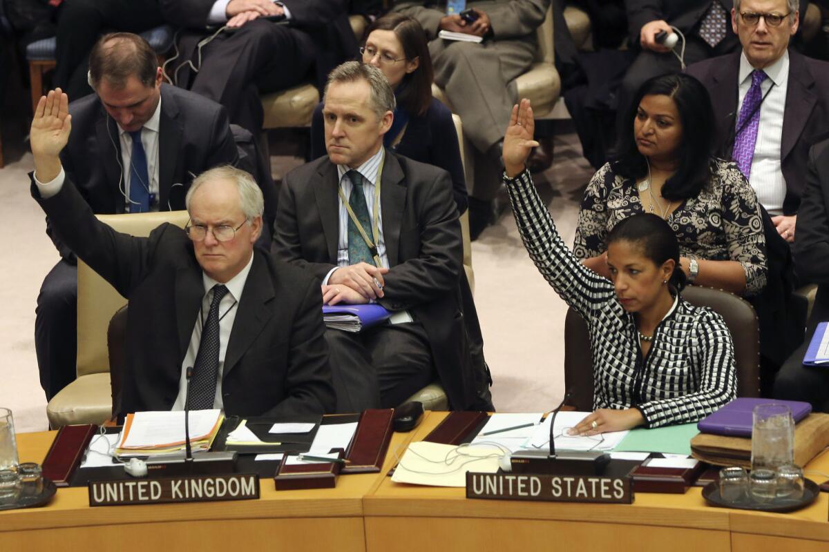 British Ambassador to the United Nations Mark Lyall Grant and U.S. Ambassador Susan Rice vote Tuesday on a Security Council resolution condemning North Korea's rocket launch.