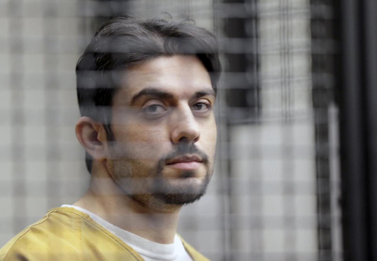 Recently recaptured Orange County prison escapee Hossein Nayeri appears in court in Santa Ana, Calif., on Tuesday. His ex-wife, Cortney Shegerian, who is an employment rights lawyer, may have had a role in some alleged crimes, police say.