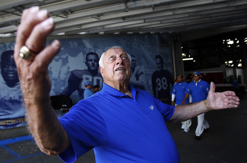 Dodgers legend Tommy Lasorda banters with fans at the Rose Bowl before a UCLA football game.