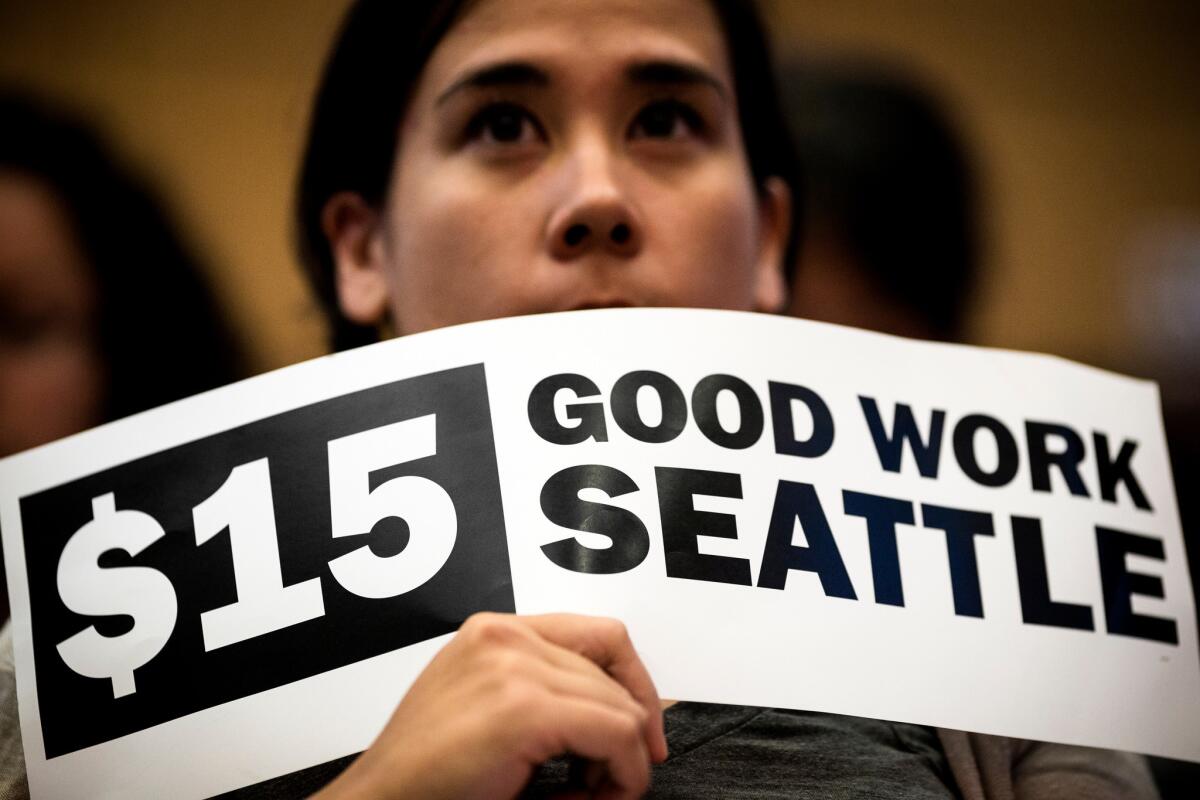 Supporters of the minimum wage increase gathered at Seattle City Hall prior to Monday's vote.