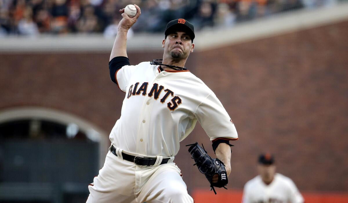 Giants starter Ryan Vogelsong delivers a pitch against the St. Louis Cardinals in Game 4 of the National League Championship Series.