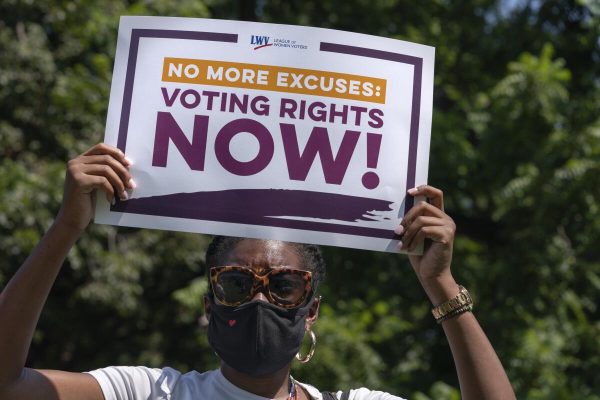 A protester rallies for a national voting rights bill in Washington on Aug. 24.