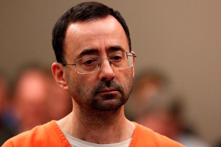 (FILES) This file photo taken on November 22, 2017 shows former Michigan State University and USA Gymnastics doctor Larry Nassar appearing at Ingham County Circuit Court in Lansing, Michigan. Larry Nassar is scheduled to be sentenced in federal court in Michigan on December 7, 2017 after pleading guilty to child pornography charges.He has also pleaded guilty to 10 counts of sexual assault in two other cases in Michigan, admitting that he abused young athletes under the guise of offering medical treatment. / AFP PHOTO / JEFF KOWALSKYJEFF KOWALSKY/AFP/Getty Images ** OUTS - ELSENT, FPG, CM - OUTS * NM, PH, VA if sourced by CT, LA or MoD **