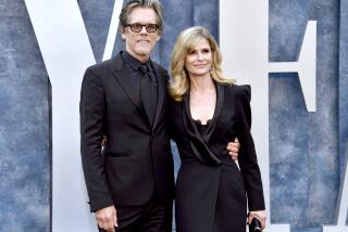 Kevin Bacon, left, and Kyra Sedgwick arrive at the Vanity Fair Oscar Party on Sunday, March 12, 2023, at the Wallis Annenberg Center for the Performing Arts in Beverly Hills, Calif. (Photo by Evan Agostini/Invision/AP)