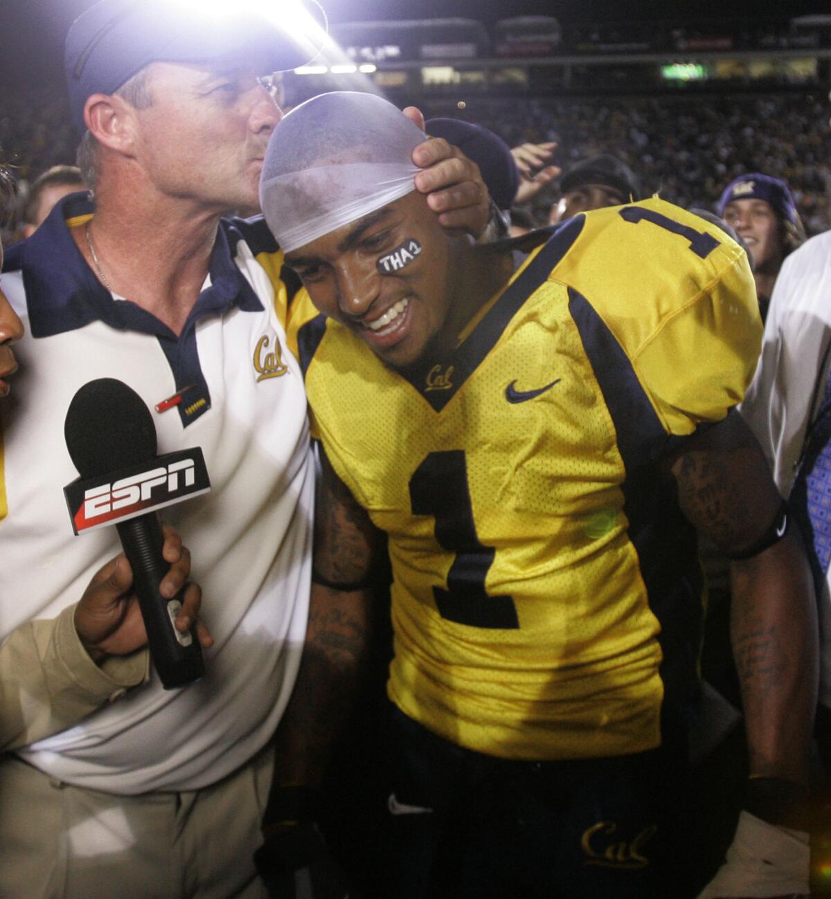 California head coach Jeff Tedford kisses receiver DeSean Jackson.