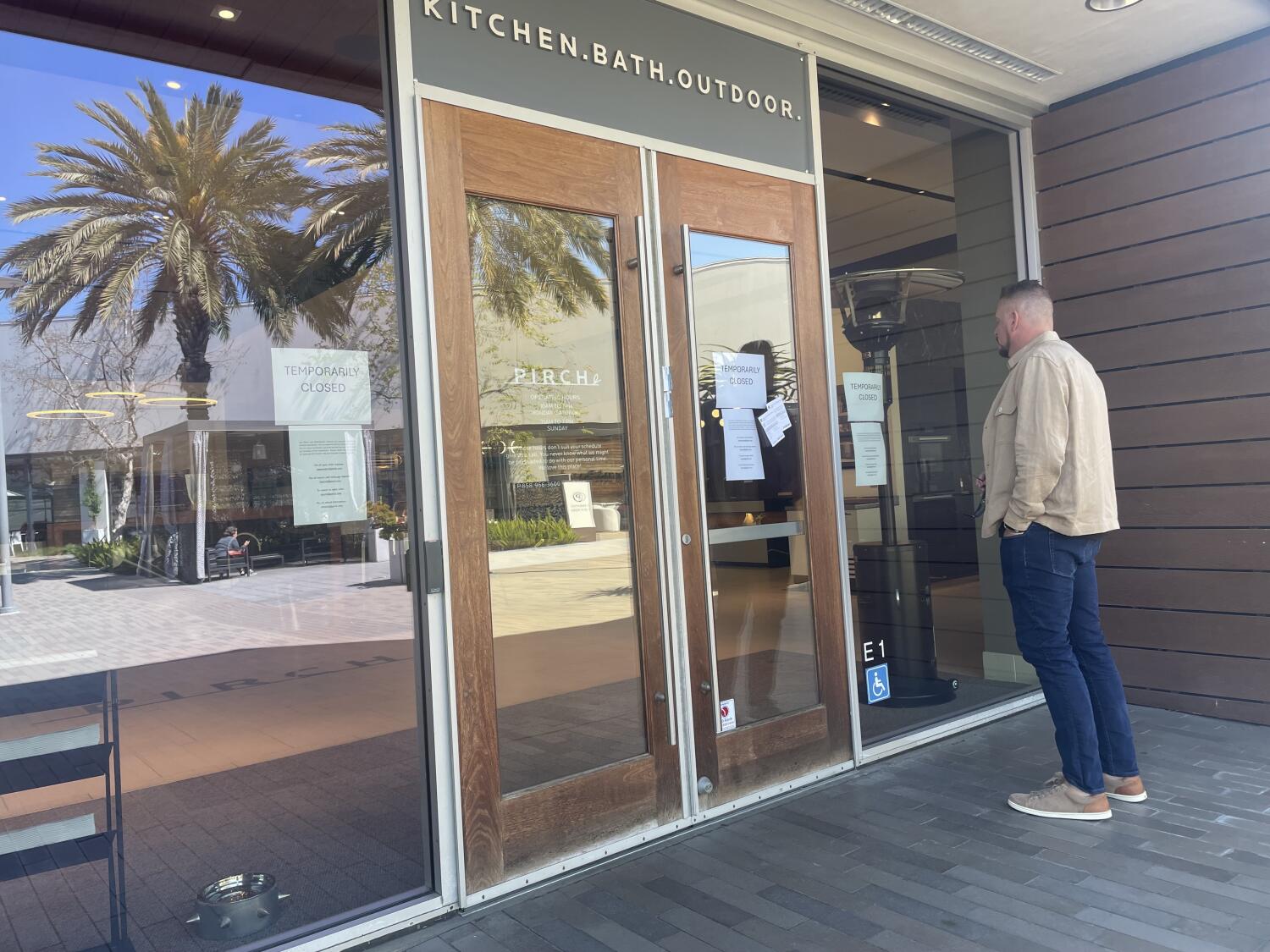 A man peers through a window of the Pirch store at Westfield UTC when it initially closed in March.