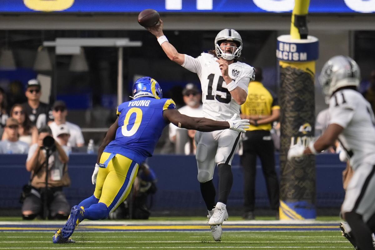 Rams linebacker Byron Young pressures Raiders quarterback Gardner Minshew during the second half.