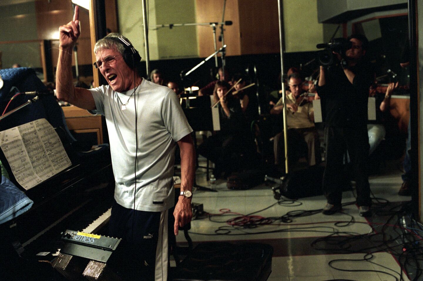 Burt Bacharach encourages musicians during a recording session