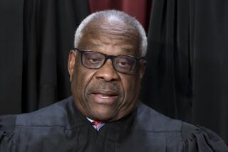 FILE - Associate Justice Clarence Thomas poses for a photo at the Supreme Court building in Washington, Oct. 7, 2022. Thomas has told attendees at a judicial conference that he and his wife have faced "nastiness and lies" over the last several years. He also decried Washington, D.C., as a "hideous place." (AP Photo/J. Scott Applewhite, File)