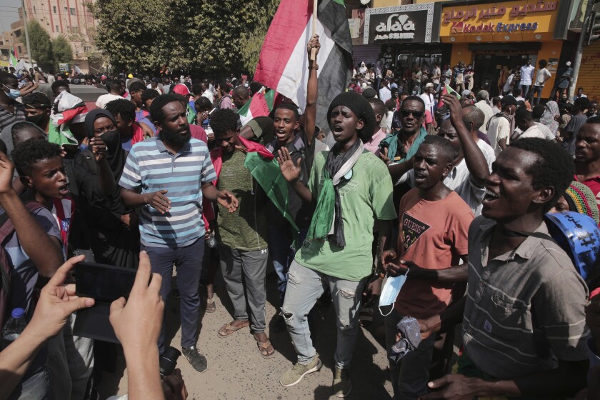 People gather during a protest in Khartoum, Sudan, Thursday, Jan. 13, 2022. Thousands of people took to the streets on Thursday against a coup that has plunged the country into grinding deadlock. (AP Photo/Marwan Ali)