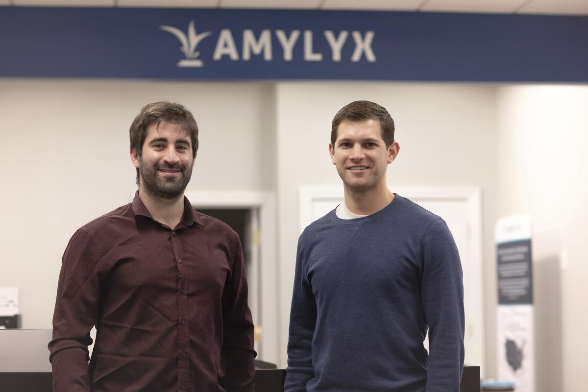 This 2018 photo provided by Amylyx shows the company's co-founders Joshua Cohen, left, and Justin Klee in Cambridge, Mass. On Friday, Sept. 2, 2022, federal health regulators remain unconvinced about the benefits of a closely watched experimental drug for the debilitating illness known as Lou Gehrig’s disease, even as they're set to give its maker, Amylyx, a rare second chance to make its case publicly. (Amylyx via AP)