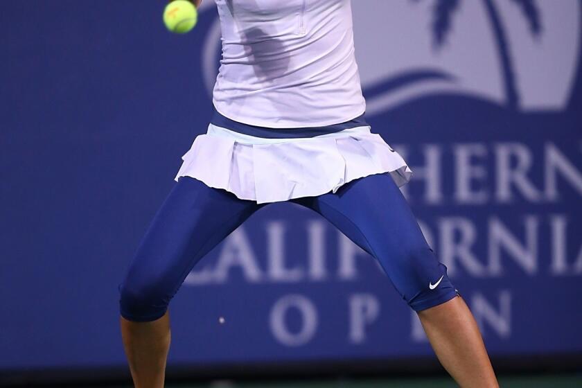 Victoria Azarenka returns a shot during her victory over Urszula Radwanska at the Southern California Open on Friday.