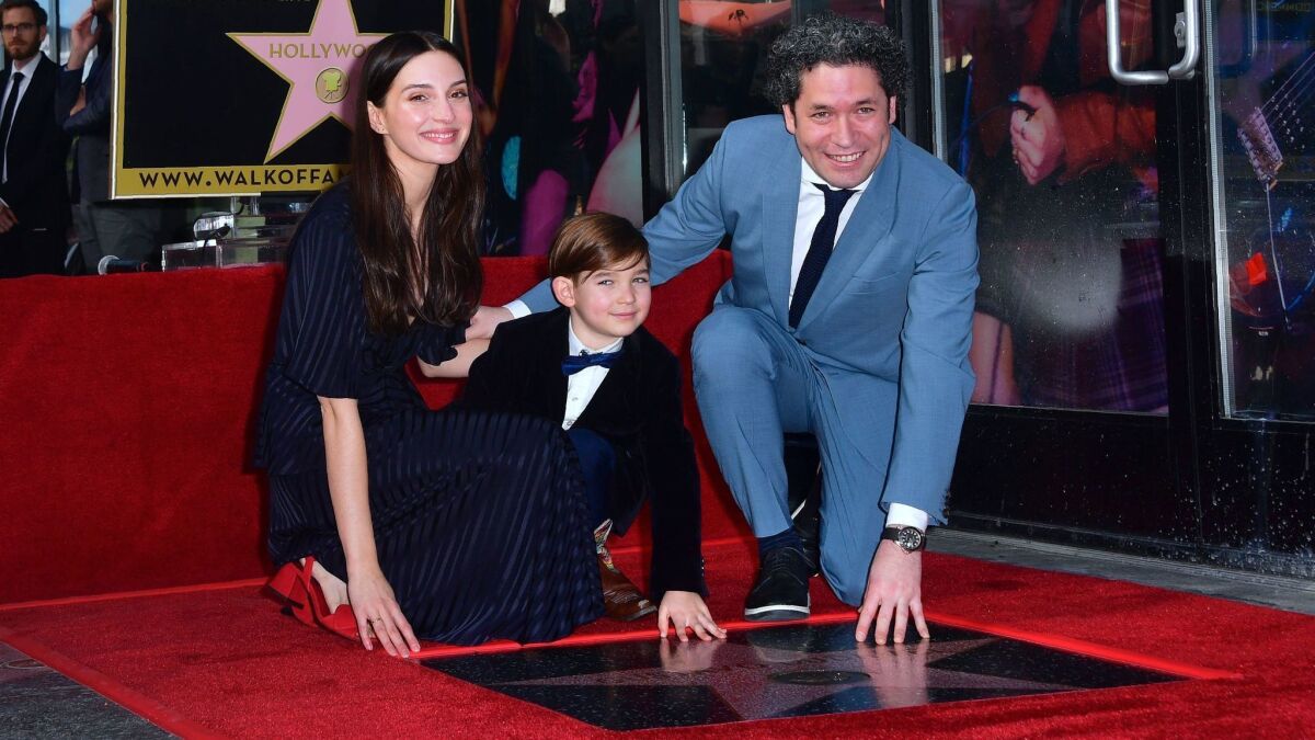 Gustavo Dudamel with wife Maria Valverde Rodriguez and son Martine at the Hollywood Walk of Fame on Tuesday.