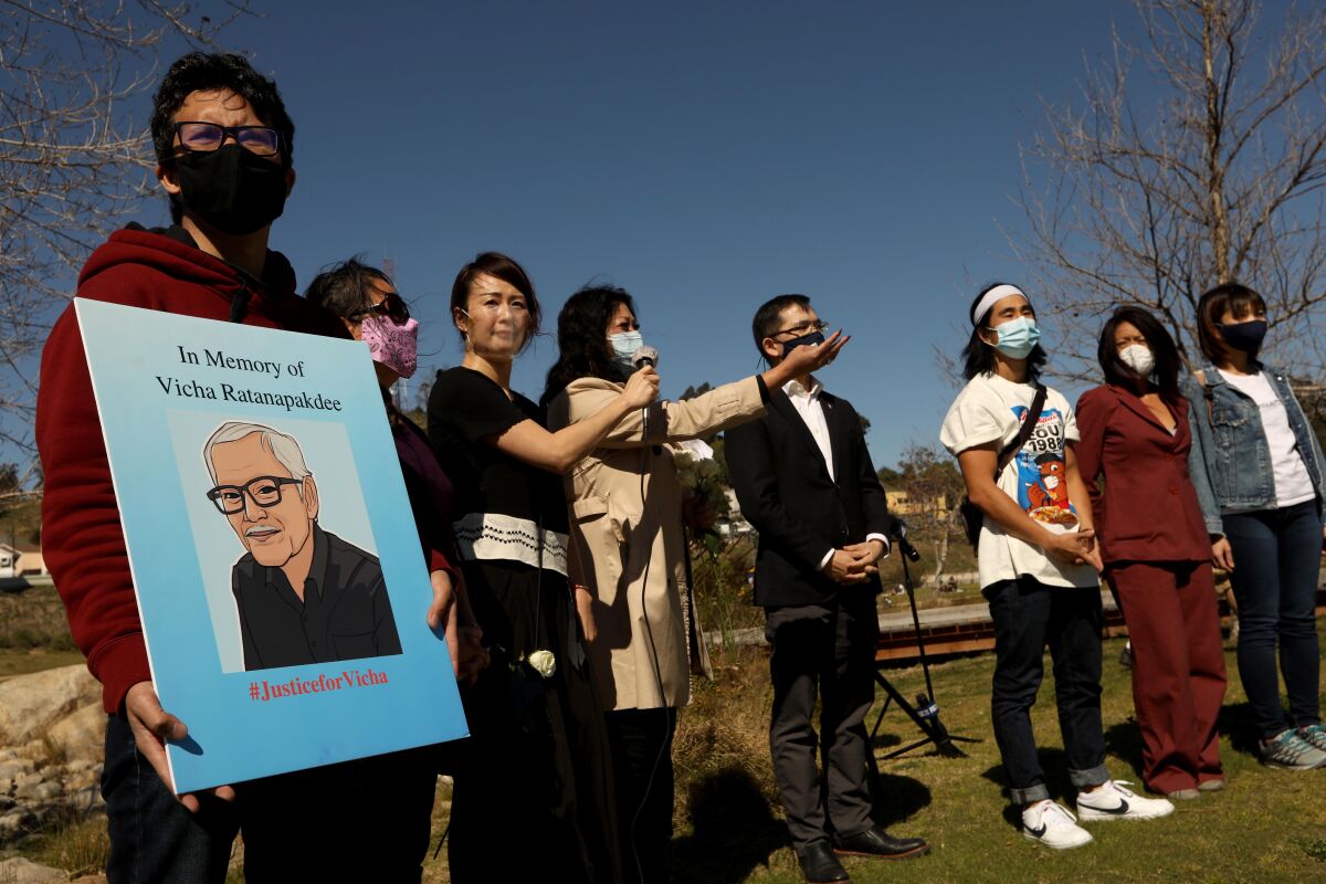 A rally against anti-Asian violence at Los Angeles Historic Park with a protester holding a poster of Vicha Ratanapakdee.