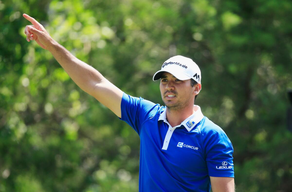 Jason Day of Australia reacts to his tee shot on the 18th hole during his semifinal match with Rory McIlroy at the WGC-Dell Match Play tournament in Austin, Texas.