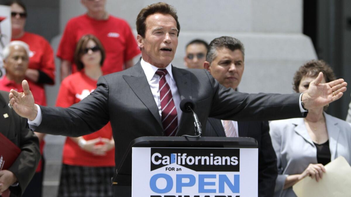 Then-Gov. Arnold Schwarzenegger and then-Lt. Gov. Abel Maldonado celebrate the passage of Proposition 14, the top-two primary initiative, on June 9, 2010.