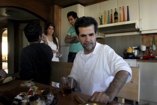 FILE - Iranian filmmaker Jafar Panahi is shown at his home after he was freed from jail on bail after more than two months in custody, in Tehran, Iran, on May 25, 2010 . Panahi who was arrested last summer, weeks before his latest film was released to widespread acclaim, has gone on hunger strike to protest his continued detention amid more than four months of anti-government protests. (AP Photo, File)