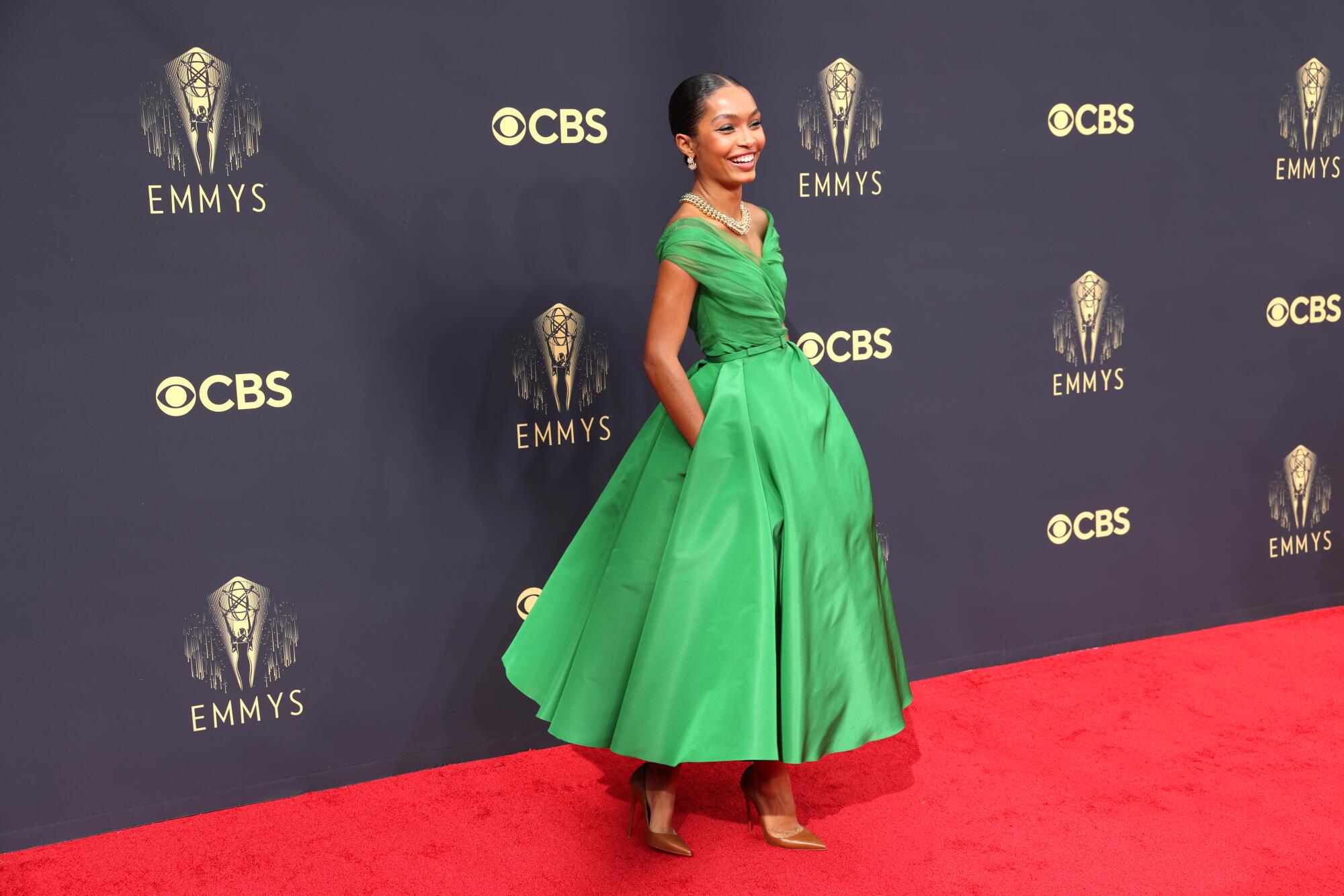 Yara Shahidi in a green dress.