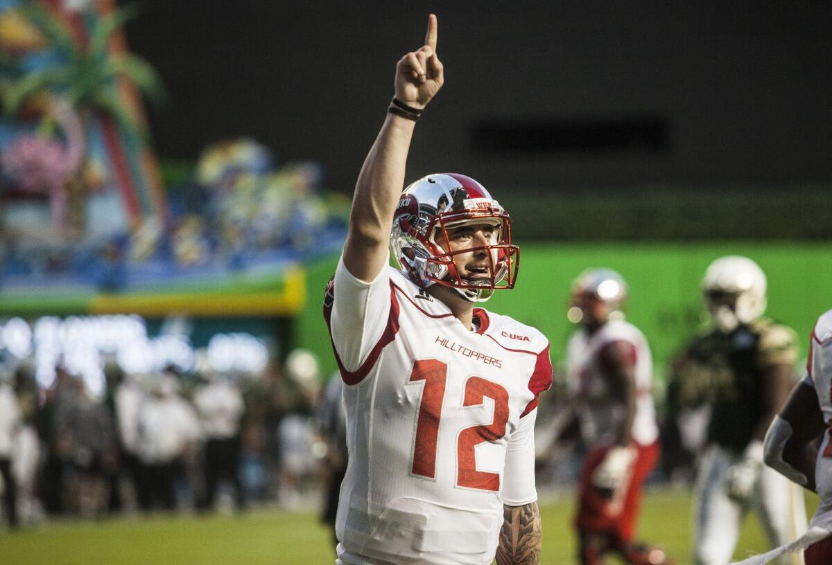 Western Kentucky quarterback Brandon Doughty celebrates a touchdown pass during the Miami Beach Bowl against South Florida.