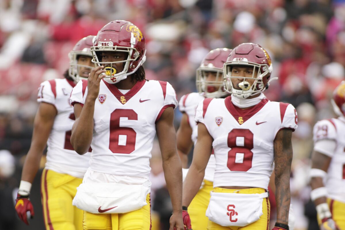 USC cornerbacks Isaac Taylor-Stuart, left, and Chris Steele stand on the field during a game against Washington State