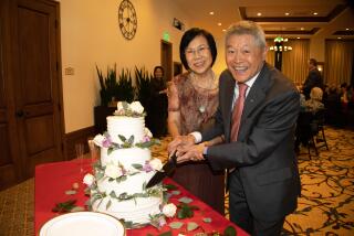 Tammy and Charles Lee cut their wedding cake Nov. 1 at the Glen at Scripps Ranch retirement community.