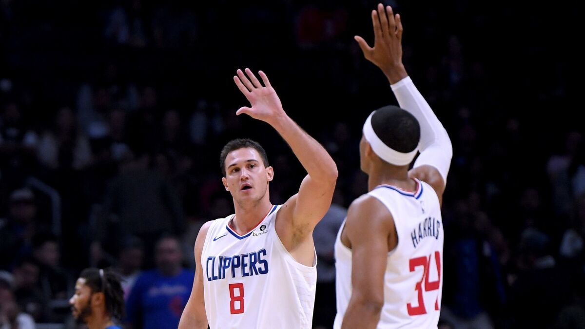 Danilo Gallinari (8) and Tobias Harris (34) of the Clippers celebrate a lead over the Minnesota Timberwolves on their way to a 120-109 win at Staples Center on Nov. 5, 2018.