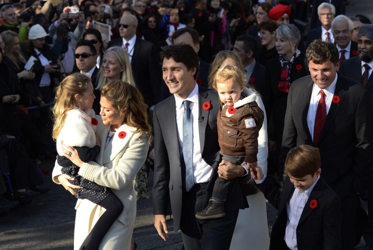 Liberal Party leader Justin Trudeau, his wife, Sophie Grégoire, and their children, Ella-Grace, Hadrien and Xavier, walk to Rideau Hall in Ottawa on Nov. 4 before his swearing in as Canada's new prime minister.