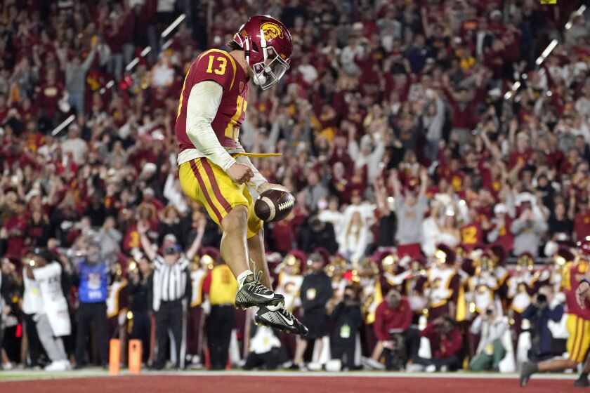 Southern California quarterback Caleb Williams celebrates after running in for a touchdown during the first half of an NCAA college football game against Notre Dame Saturday, Nov. 26, 2022, in Los Angeles. (AP Photo/Mark J. Terrill)