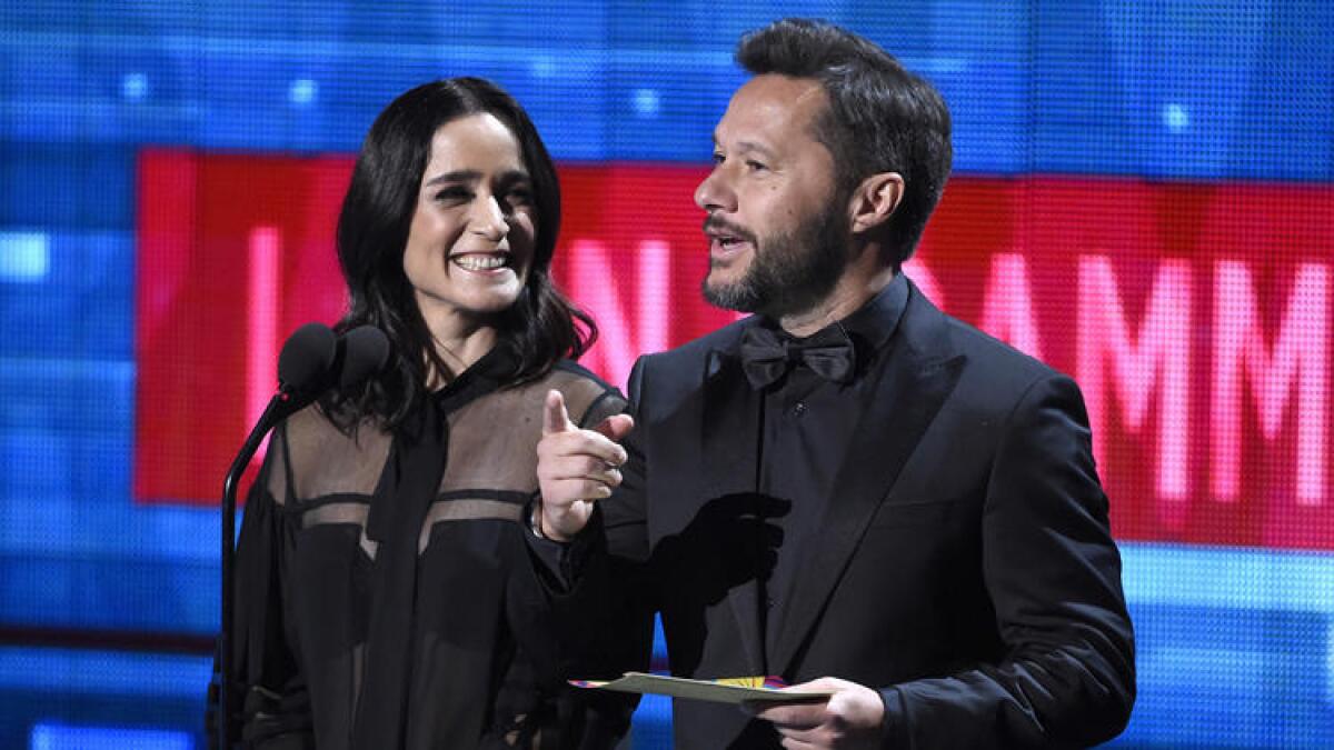 Diego Torres, seen here with Julieta Venegas at the 2015 Latin Grammys, is up for Latin pop album at the 59th Grammy Awards..