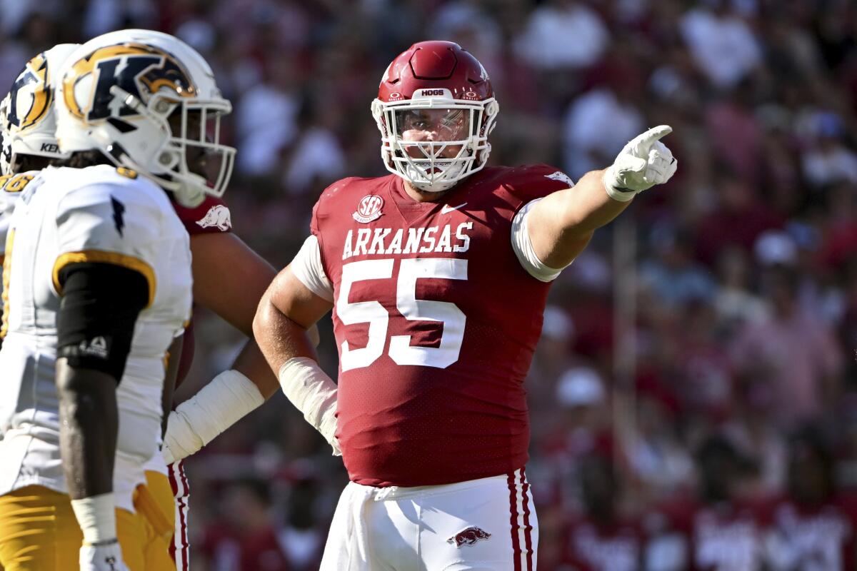 Arkansas offensive lineman Beaux Limmer (55) gets ready to run a play against Kent State.