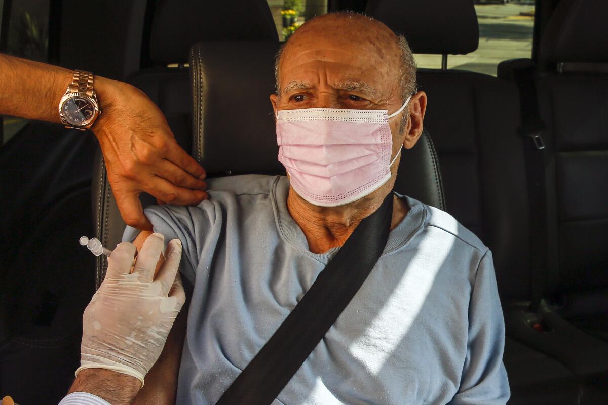 Mardiros Ebrahamian, 82, gets a Moderna vaccine booster in La Cañada Flintridge.