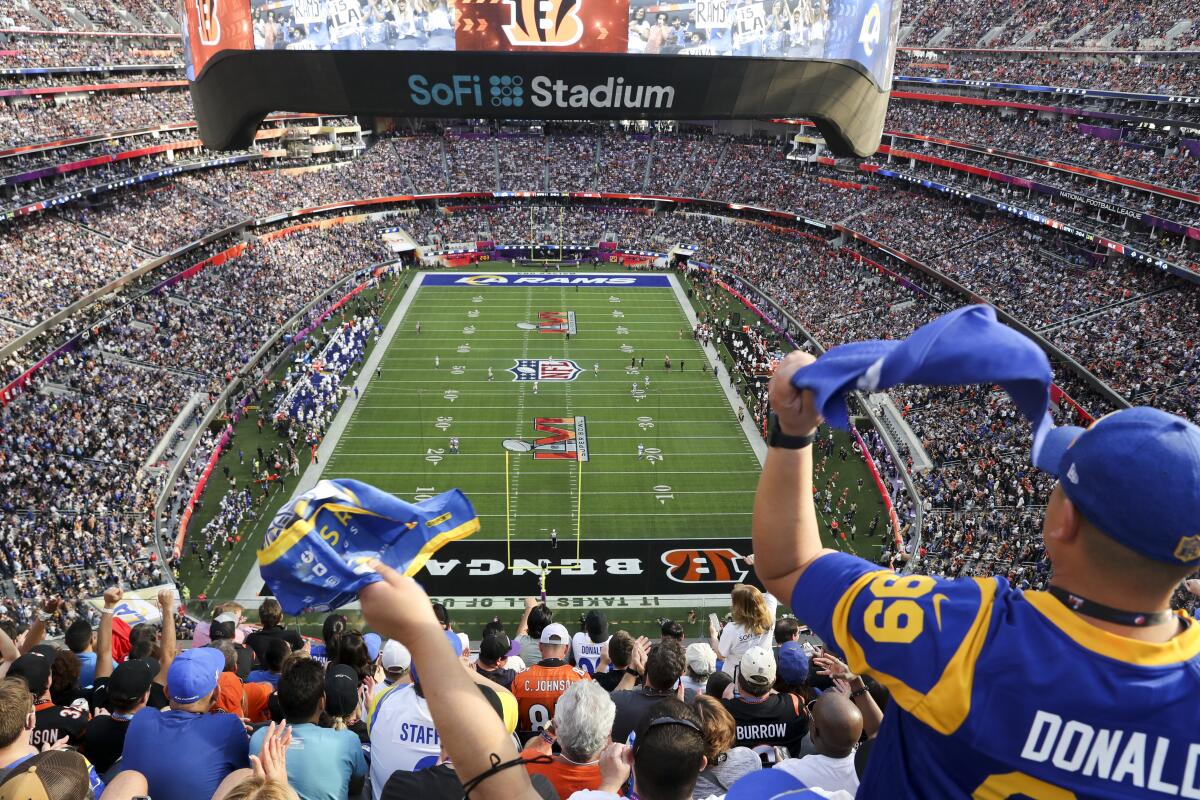 Rams fans wave flags during the Super Bowl
