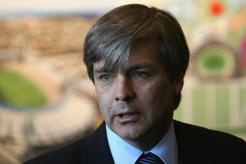 Harold Mayne-Nicholls, the former head of the FIFA inspection team, speaks during an inspection tour in Melbourne, Australia, in July 2010. FIFA's ethics committee has banned him from "any kind of football-related activity at national and international level" for seven years, but gave no reason for the decision.