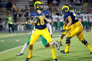 Millikan’s JP Mialovski looks to pass as the Rams take on Upland in a Sept. 8 game.