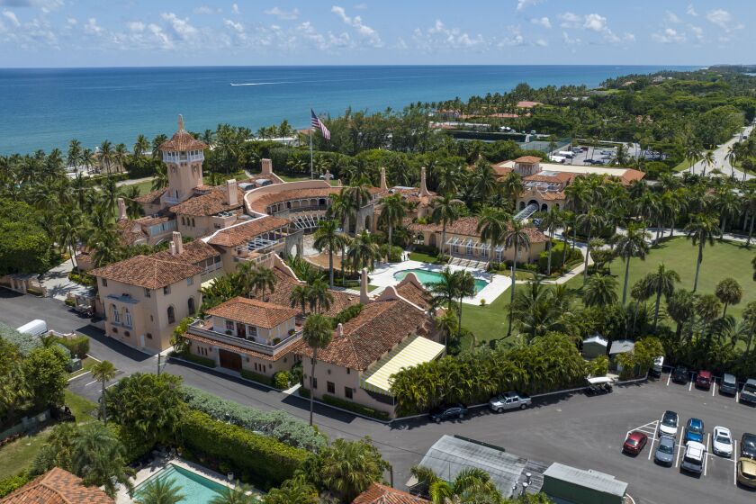 FILE - Former President Donald Trump's Mar-a-Lago club is seen in the aerial view in Palm Beach, Fla., Aug. 31, 2022. A federal appeals court has halted an independent review of documents seized from the estate, removing a hurdle the Justice Department said had delayed its criminal investigation into the retention of top secret government information. (AP Photo/Steve Helber, File)
