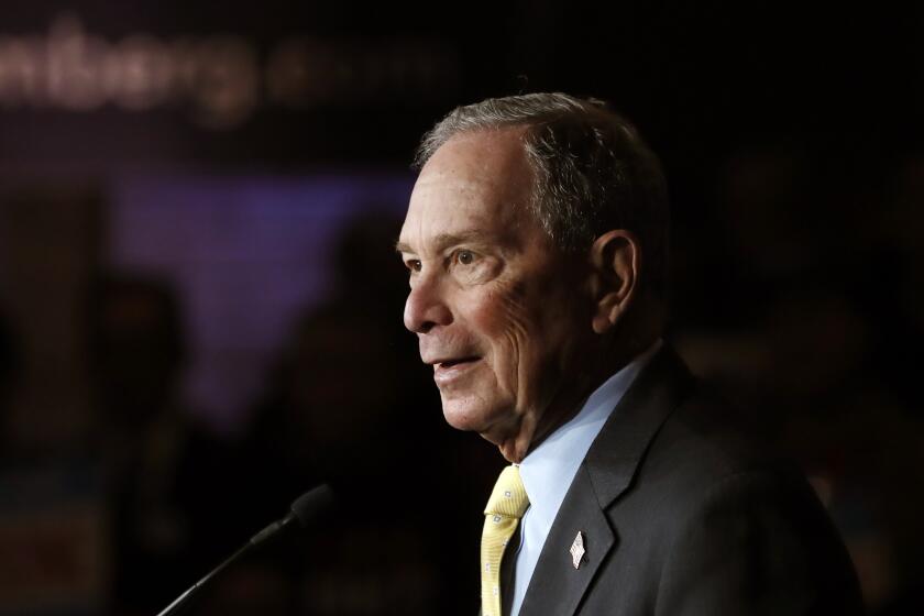FILE - In this Tuesday, Feb. 4, 2020, file photo, Democratic presidential candidate and former New York City Mayor Michael Bloomberg talks to supporters, in Detroit. Bloomberg won the votes of New Hampshire's Dixville Notch community, hanging onto its tradition of being among the first to cast ballots in the presidential primary, early Tuesday, Feb. 11. (AP Photo/Carlos Osorio, File)