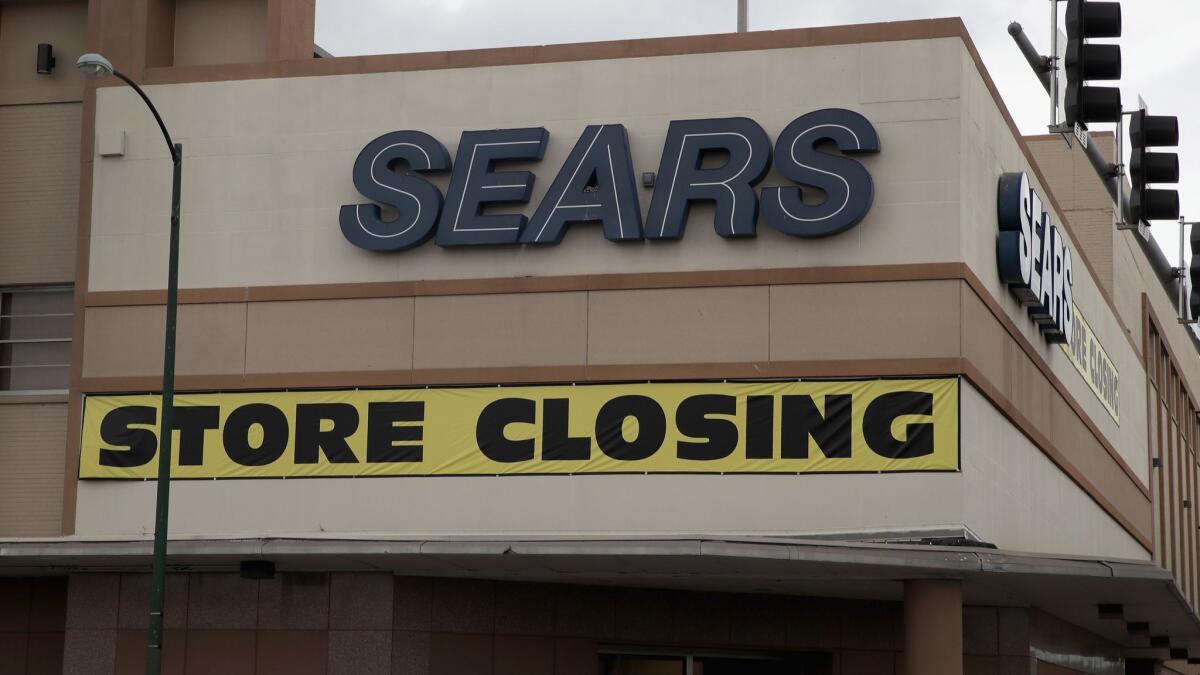 A Sears store in Chicago bears a "store closing" sign in 2017. The company has since announced additional closures.