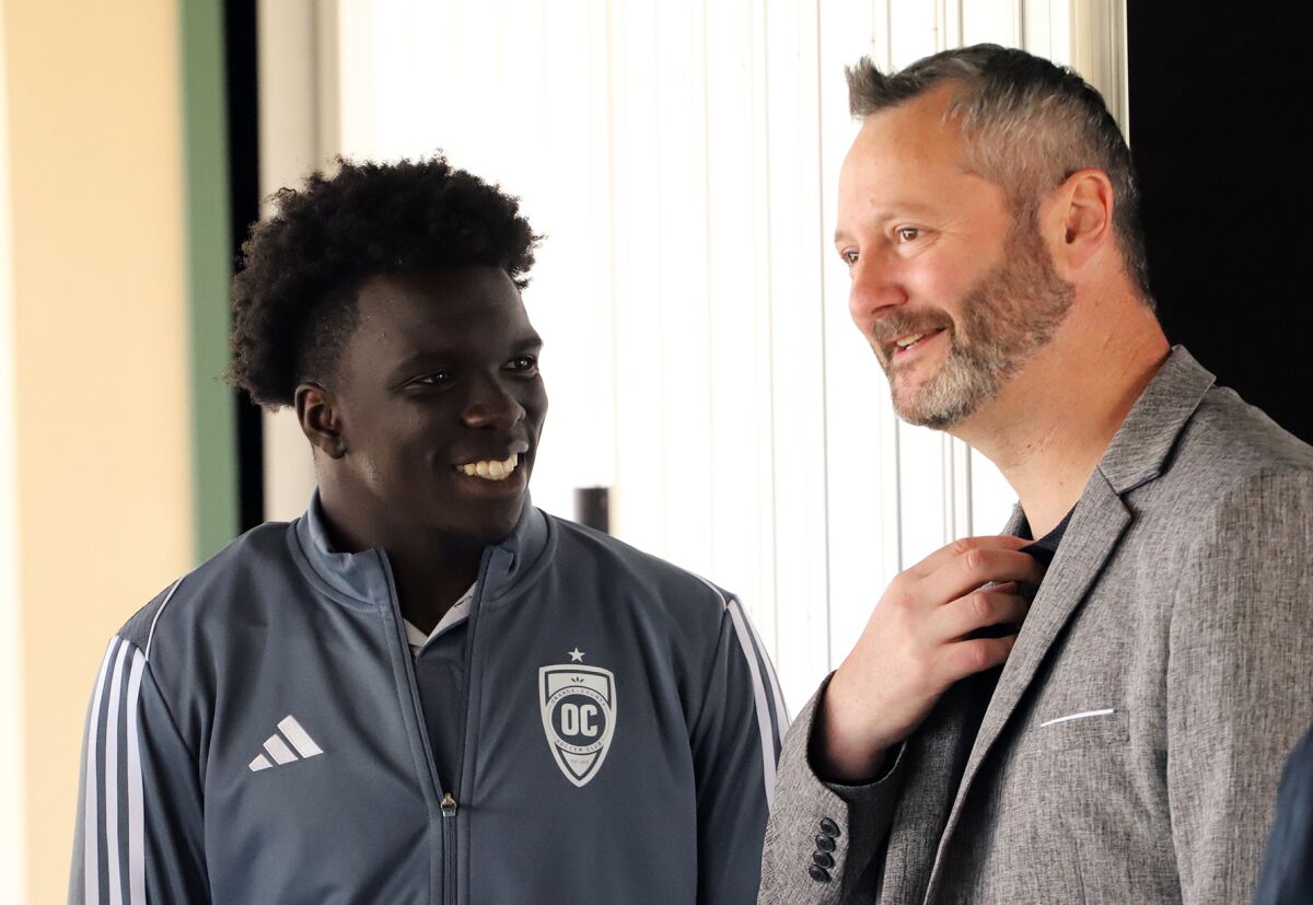 Orange County Soccer Club forward Kerede Osundina, left, and president of business relations Daniel Rutstein on Tuesday.