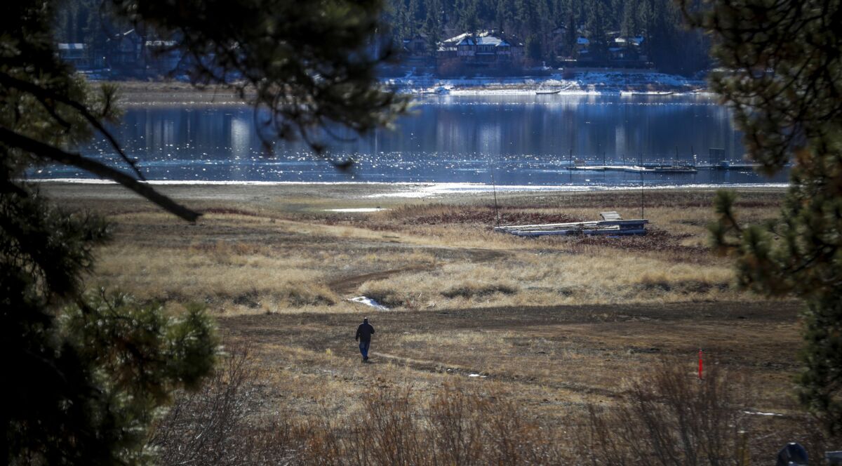 Vincent Ward walks on the north shore of the lake on an annual survey of the bald eagle population at Big Bear Lake.