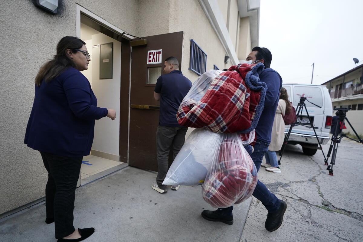 Official bring new blankets into St. Anthony's Croatian Catholic Church in Los Angeles
