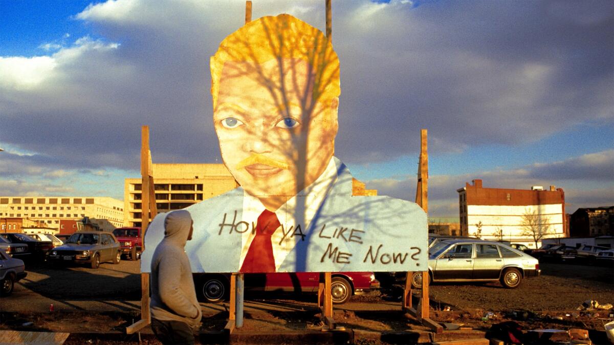 A billboard of Jesse Jackson in whiteface by artist David Hammons