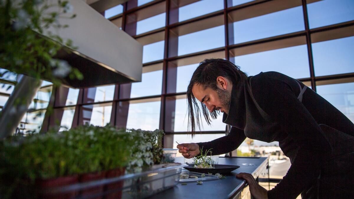 Jordan Kahn plates a dish in Vespertine's kitchen.