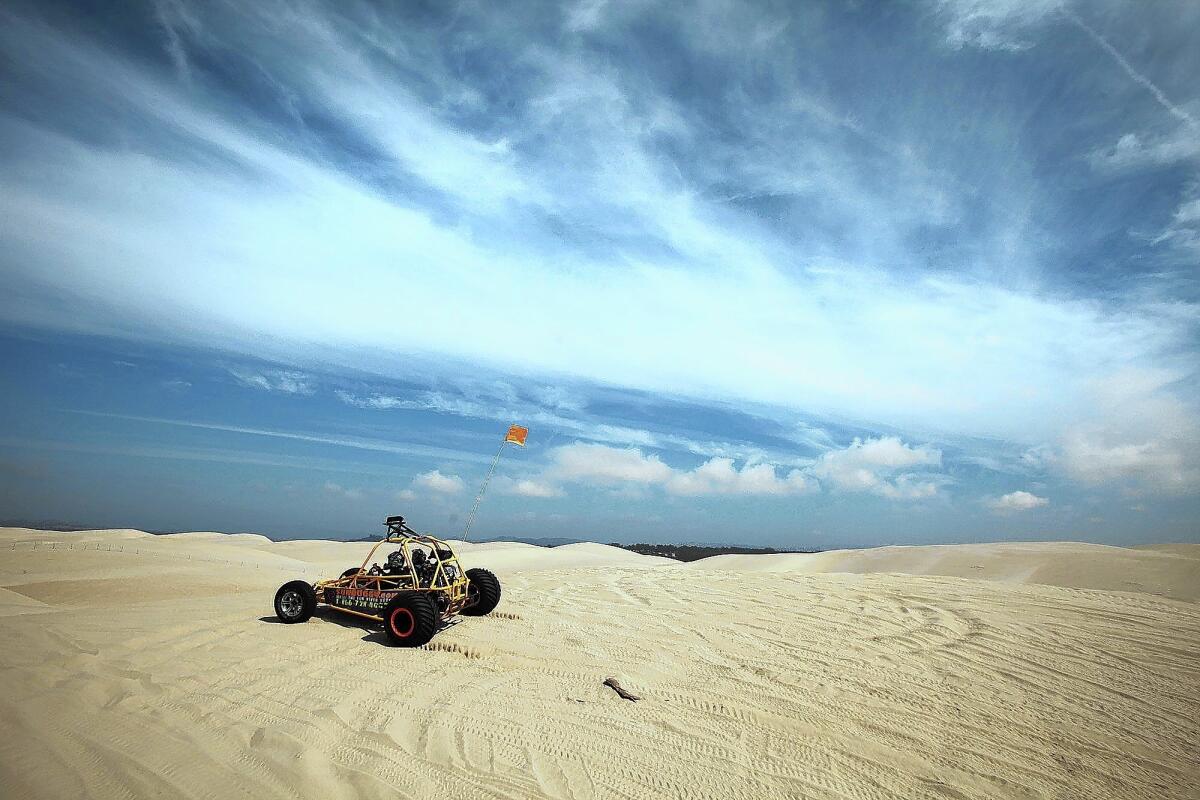 An off-roader drives on the sand at Oceano Dunes State Vehicular Recreation Area near Grover Beach, Calif.